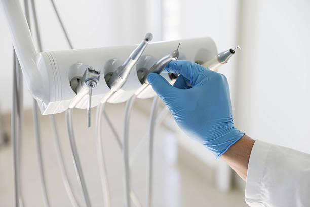 Professional Tooth Extraction technician working in Sugar Land, TX